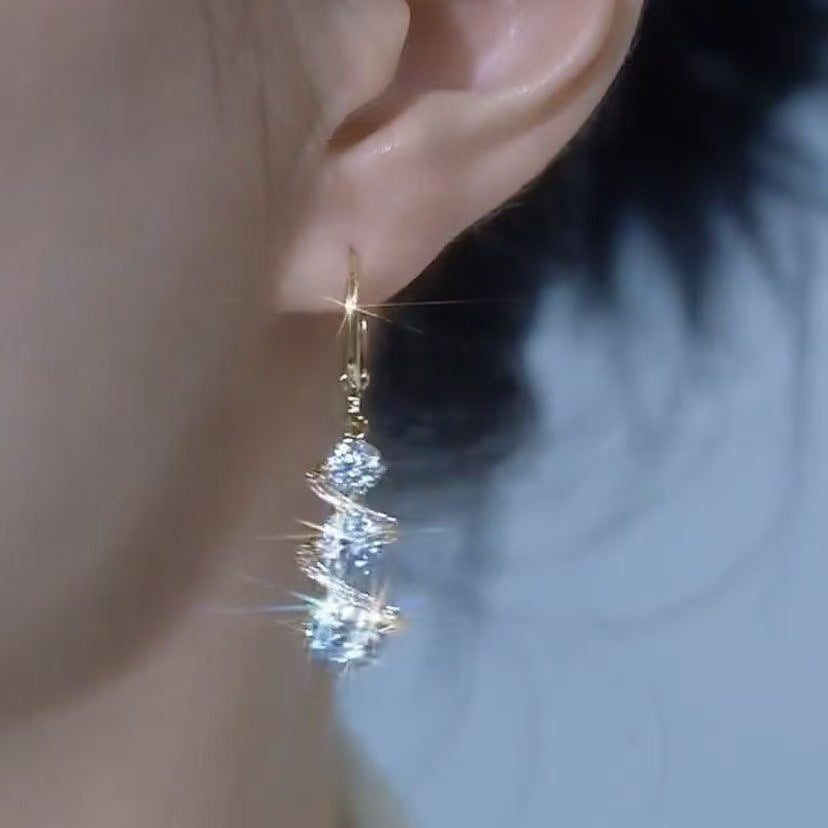 High-end temperament water drop earrings 2026 new trendy niche design Internet celebrity light luxury stud earrings